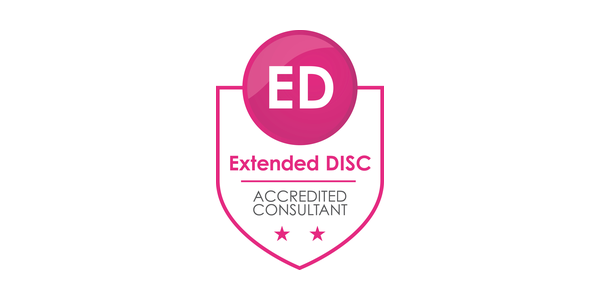 Extended DISC Accredited Consultant badge in magenta.